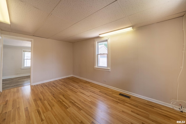 116 S 8th Ave, Canton, IL 61520 - empty room featuring light wood-style floors, baseboards, and plenty of natural light
