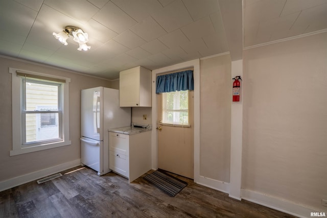 116 S 8th Ave, Canton, IL 61520 - kitchen featuring crown molding, white cabinets, dark wood finished floors, freestanding refrigerator, and baseboards
