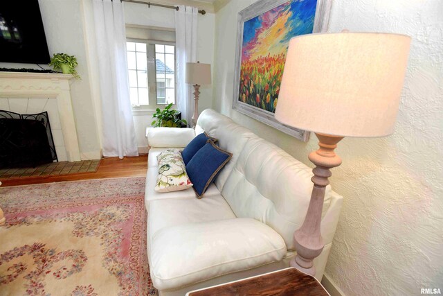 3307 N Biltmore Ave, Peoria, IL 61604 - living area with wood finished floors and a tiled fireplace