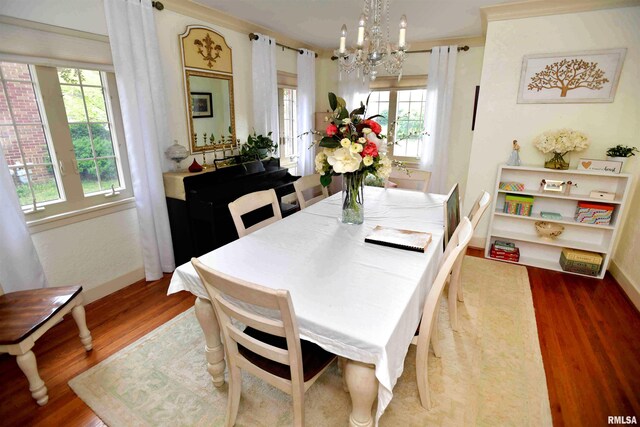 3307 N Biltmore Ave, Peoria, IL 61604 - dining room with wood finished floors, a chandelier, and plenty of natural light