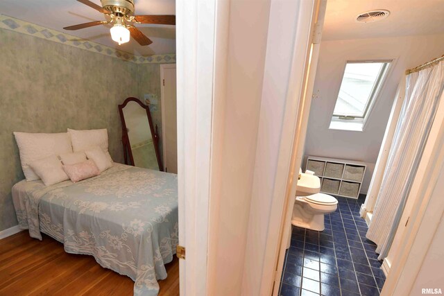 3307 N Biltmore Ave, Peoria, IL 61604 - bedroom with a skylight, connected bathroom, and ceiling fan