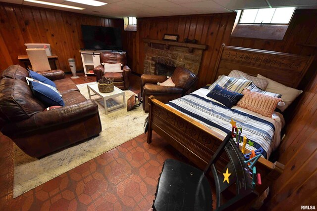 3307 N Biltmore Ave, Peoria, IL 61604 - bedroom featuring wood walls and a fireplace