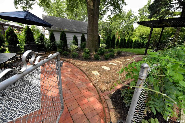 3307 N Biltmore Ave, Peoria, IL 61604 - view of yard featuring outdoor dining area, a patio, and a pergola