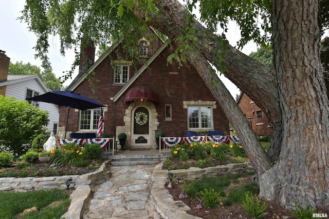 3307 N Biltmore Ave, Peoria, IL 61604 - tudor home featuring brick siding and a chimney