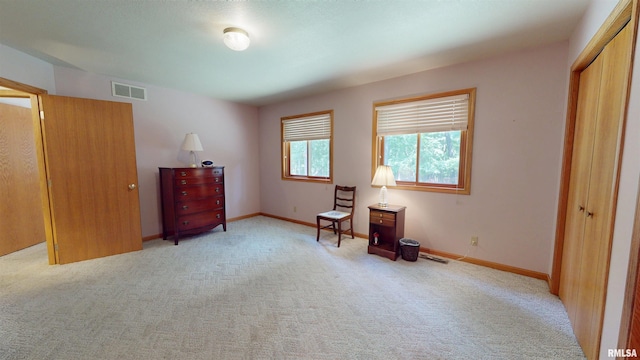 1111 Windy Hill Ct, Varna, IL 61375 - bedroom with light carpet, a closet, and baseboards