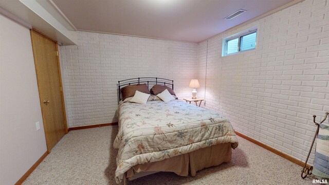 1111 Windy Hill Ct, Varna, IL 61375 - bedroom with baseboards, brick wall, and carpet