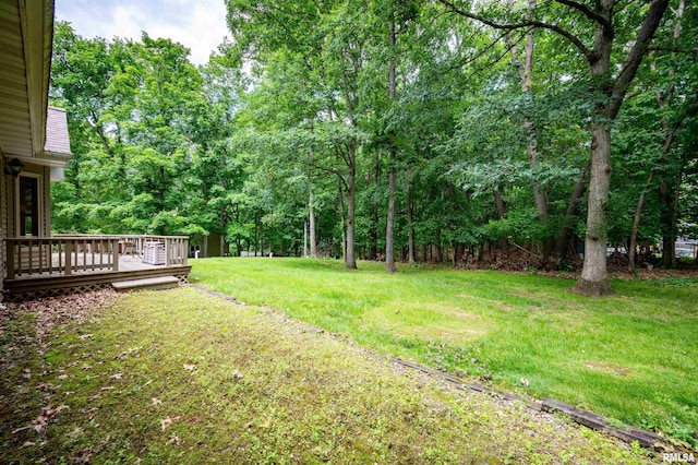 1111 Windy Hill Ct, Varna, IL 61375 - view of green lawn with a wooden deck