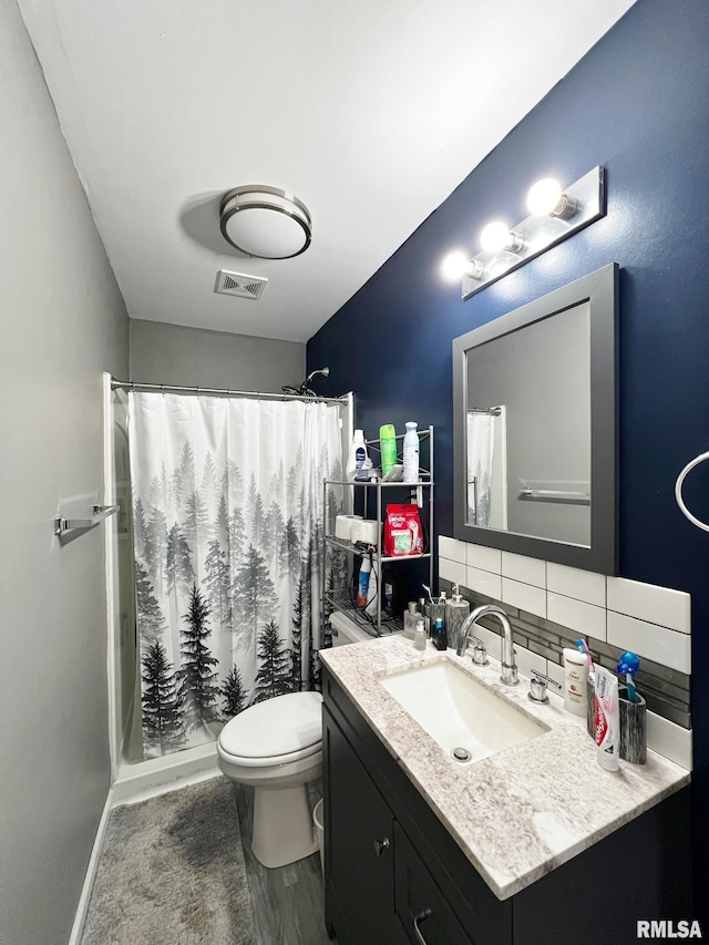 1520 N Finney St, Chillicothe, IL 61523 - full bath with vanity, toilet, a shower with shower curtain, and decorative backsplash