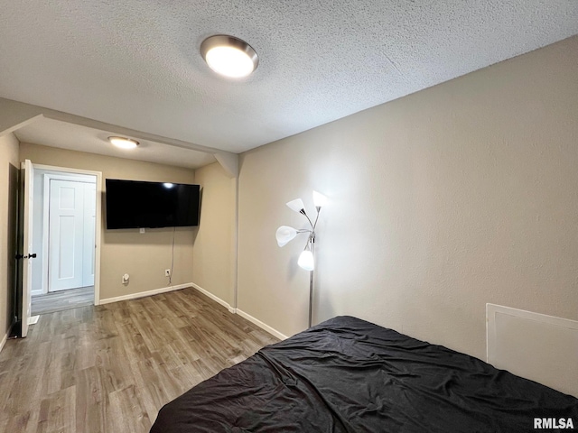 1520 N Finney St, Chillicothe, IL 61523 - bedroom with wood finished floors, baseboards, and a textured ceiling