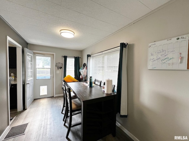 1520 N Finney St, Chillicothe, IL 61523 - dining space with light wood-style floors, baseboards, and a desk
