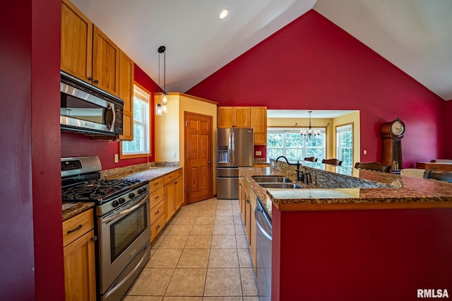 4627 S Queen Aleta Ct, Mapleton, IL 61547 - kitchen featuring appliances with stainless steel finishes, a sink, pendant lighting, high vaulted ceiling, and a chandelier