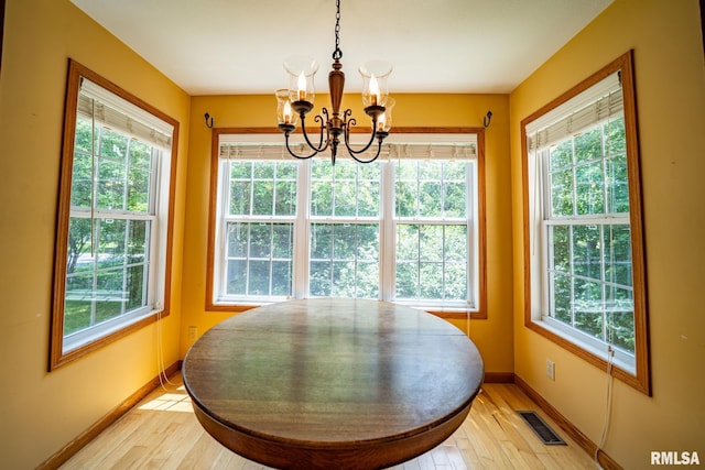 4627 S Queen Aleta Ct, Mapleton, IL 61547 - dining space with a chandelier, healthy amount of natural light, baseboards, and light wood finished floors