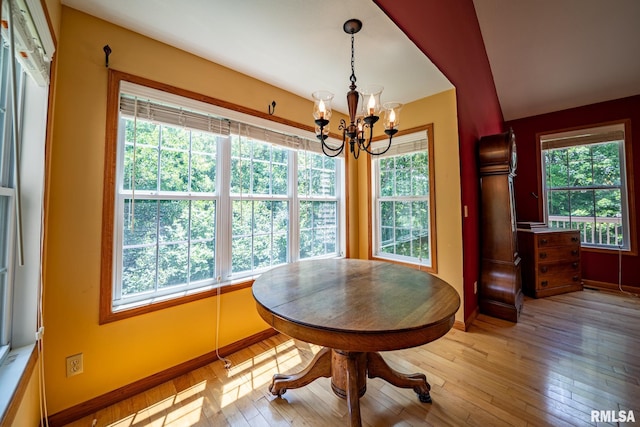 4627 S Queen Aleta Ct, Mapleton, IL 61547 - dining area with hardwood / wood-style flooring, a chandelier, and baseboards