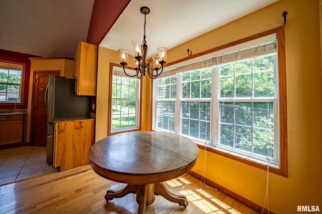 4627 S Queen Aleta Ct, Mapleton, IL 61547 - dining room featuring a chandelier and light wood-type flooring