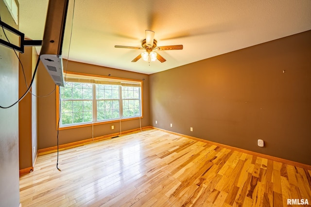 4627 S Queen Aleta Ct, Mapleton, IL 61547 - empty room featuring a ceiling fan and wood finished floors