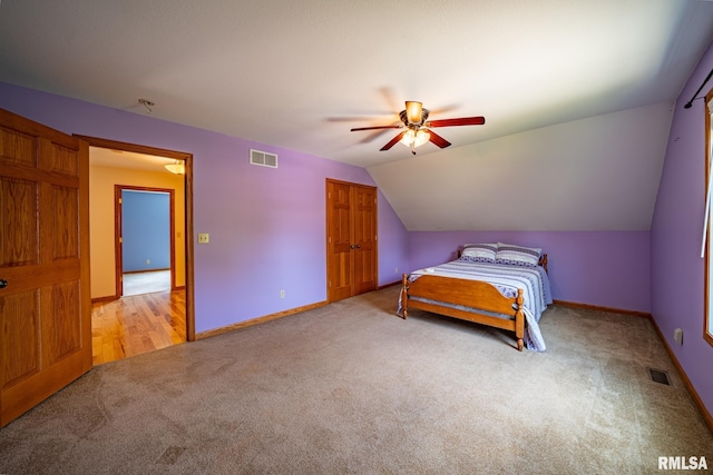 4627 S Queen Aleta Ct, Mapleton, IL 61547 - carpeted bedroom with baseboards, vaulted ceiling, ceiling fan, and a closet