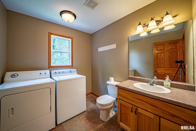 4627 S Queen Aleta Ct, Mapleton, IL 61547 - bathroom featuring washing machine and dryer, vanity, toilet, baseboards, and tile patterned flooring