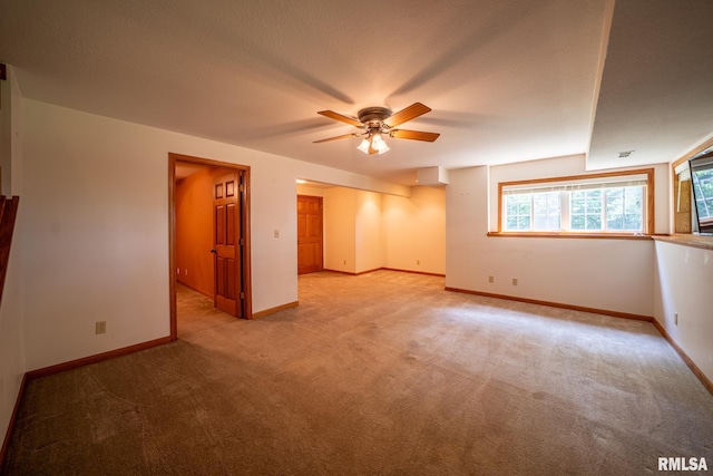 4627 S Queen Aleta Ct, Mapleton, IL 61547 - empty room featuring light colored carpet, ceiling fan, and baseboards