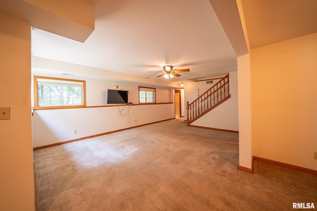 4627 S Queen Aleta Ct, Mapleton, IL 61547 - unfurnished living room featuring carpet floors, baseboards, stairs, and a ceiling fan