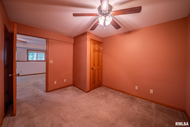 4627 S Queen Aleta Ct, Mapleton, IL 61547 - empty room with a ceiling fan, light colored carpet, baseboards, and a textured ceiling