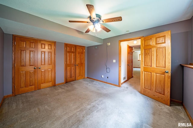 4627 S Queen Aleta Ct, Mapleton, IL 61547 - unfurnished bedroom featuring baseboards, multiple closets, carpet floors, and a ceiling fan