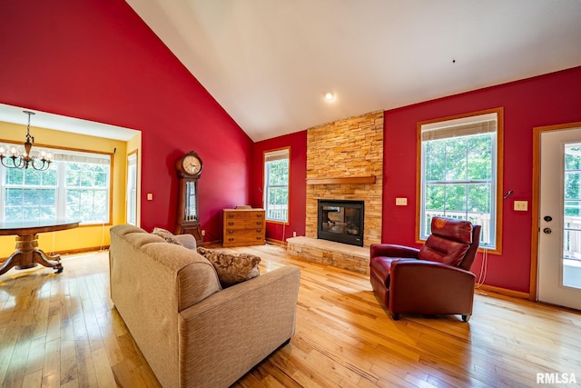 4627 S Queen Aleta Ct, Mapleton, IL 61547 - living room featuring wood-type flooring, plenty of natural light, a fireplace, and high vaulted ceiling
