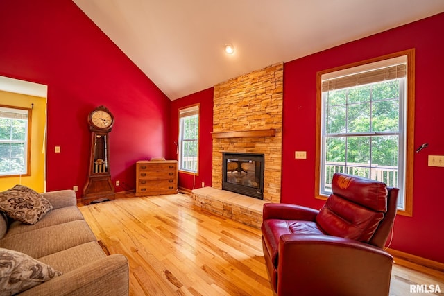 4627 S Queen Aleta Ct, Mapleton, IL 61547 - living room featuring wood finished floors, a fireplace, baseboards, and high vaulted ceiling