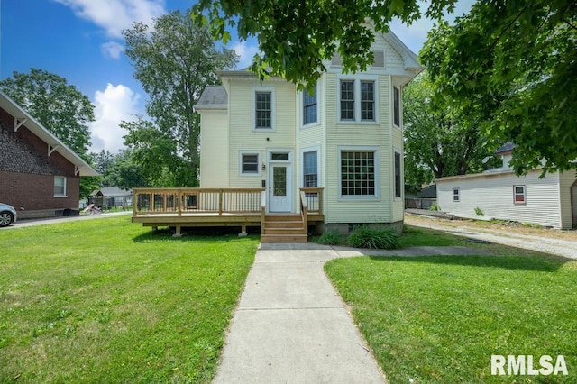 307 N Logan St, Deer Creek, IL 61733 - victorian home featuring a front lawn and a deck