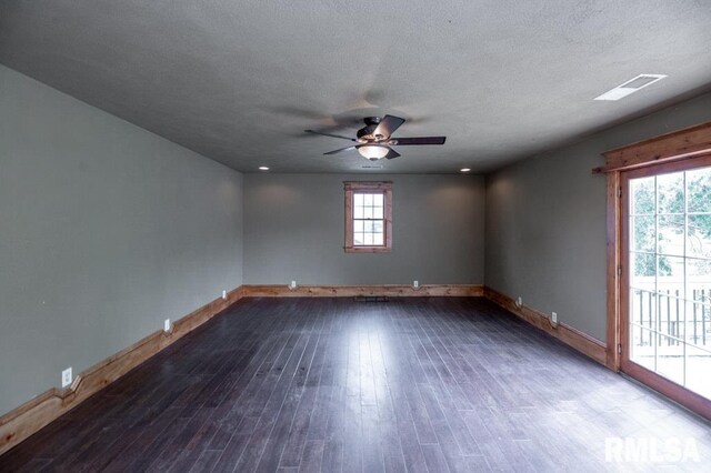 307 N Logan St, Deer Creek, IL 61733 - unfurnished room with baseboards, a ceiling fan, wood finished floors, and a textured ceiling