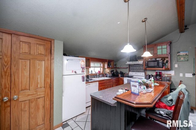 307 N Logan St, Deer Creek, IL 61733 - kitchen featuring white appliances, a sink, light tile patterned floors, pendant lighting, and a kitchen bar