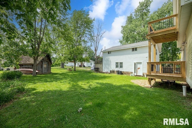 307 N Logan St, Deer Creek, IL 61733 - view of green lawn featuring a wooden deck