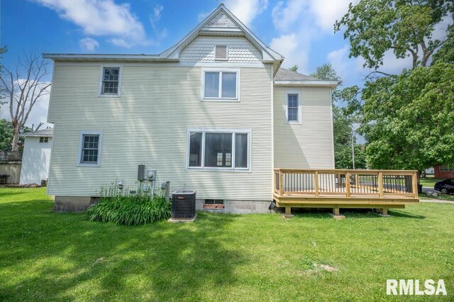 307 N Logan St, Deer Creek, IL 61733 - rear view of house with a deck, central AC, and a yard