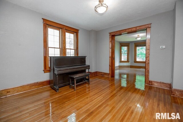307 N Logan St, Deer Creek, IL 61733 - living area with baseboards and light wood-style flooring