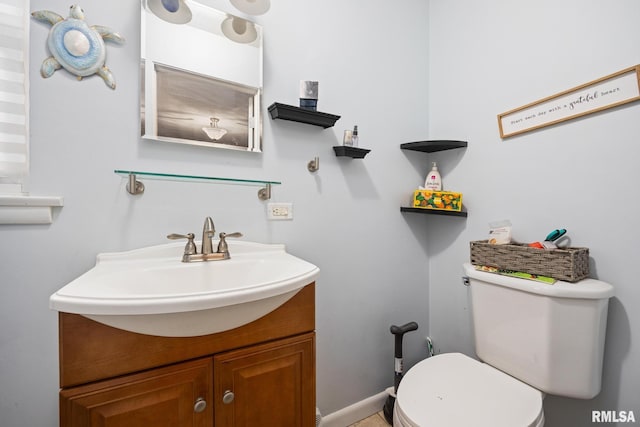 51 Lynnwood Ct, Morton, IL 61550 - half bathroom featuring vanity, toilet, and baseboards