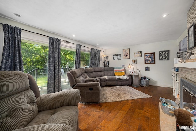 51 Lynnwood Ct, Morton, IL 61550 - living area featuring a glass covered fireplace, dark wood-type flooring, healthy amount of natural light, recessed lighting, and baseboards
