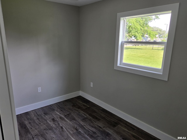 433 N Prairie Ave, Macomb, IL 61455 - unfurnished room featuring baseboards and dark wood finished floors