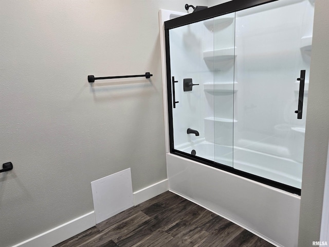433 N Prairie Ave, Macomb, IL 61455 - bathroom featuring enclosed tub / shower combo and wood finished floors