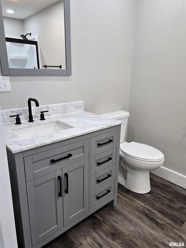 433 N Prairie Ave, Macomb, IL 61455 - bathroom featuring vanity and wood finished floors