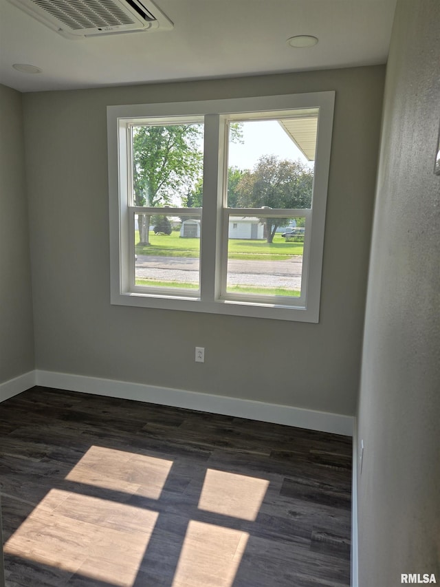 433 N Prairie Ave, Macomb, IL 61455 - unfurnished room with healthy amount of natural light and dark wood-style flooring