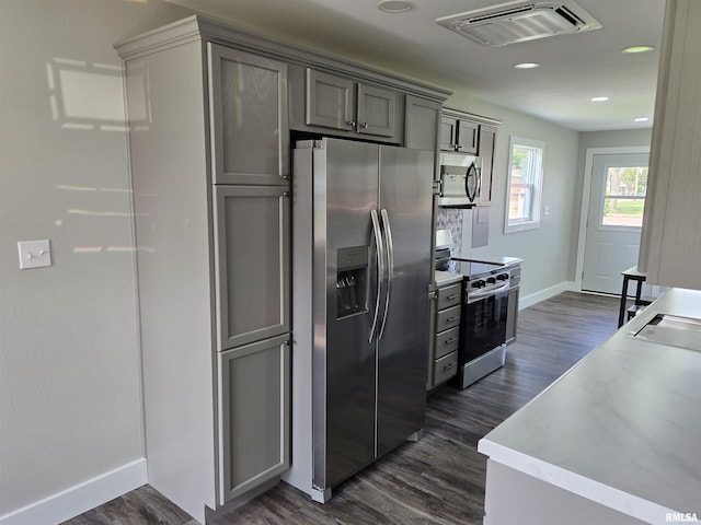 433 N Prairie Ave, Macomb, IL 61455 - kitchen with appliances with stainless steel finishes, dark wood-type flooring, recessed lighting, light countertops, and gray cabinets