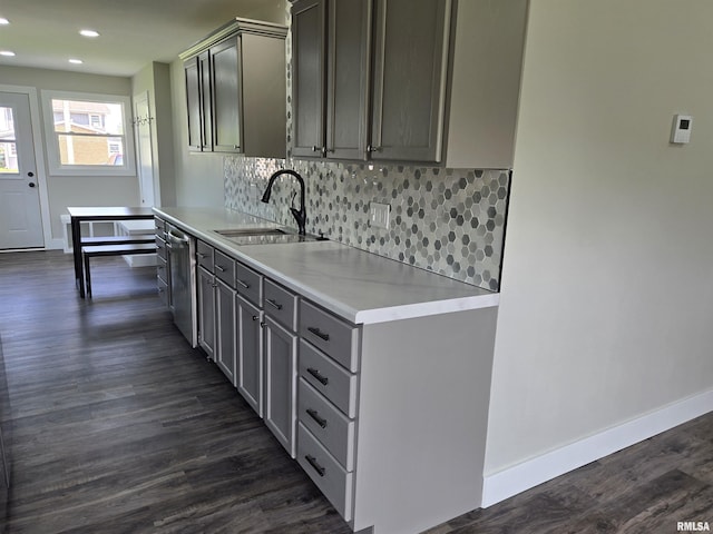 433 N Prairie Ave, Macomb, IL 61455 - kitchen with gray cabinets, dishwasher, backsplash, dark wood-type flooring, and light countertops