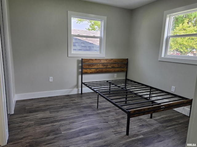 433 N Prairie Ave, Macomb, IL 61455 - bedroom with dark wood-type flooring and baseboards