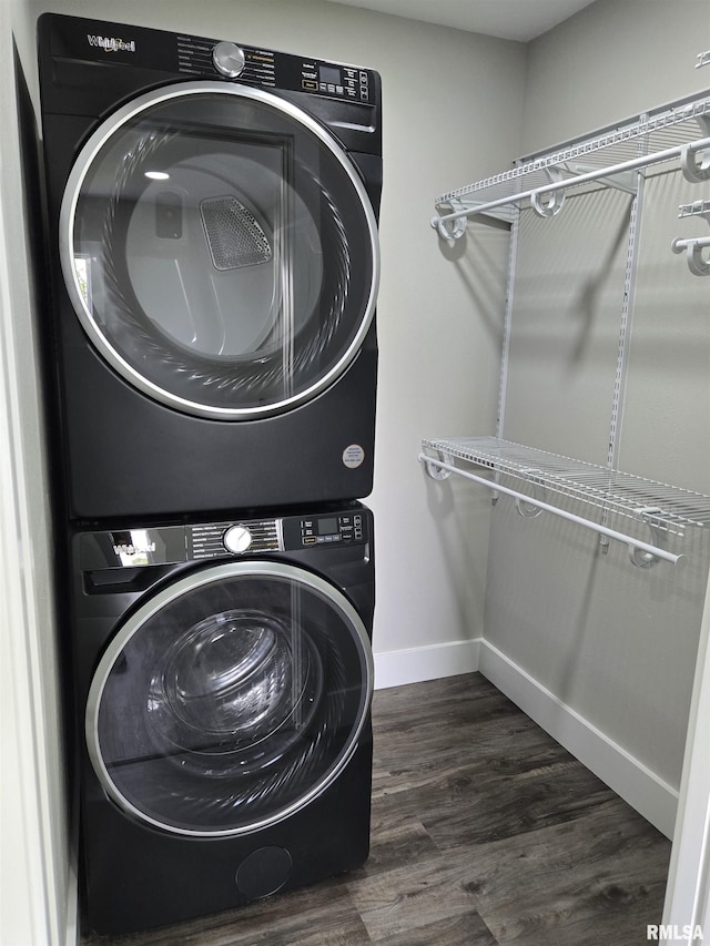 433 N Prairie Ave, Macomb, IL 61455 - washroom with stacked washing machine and dryer and dark wood-style flooring