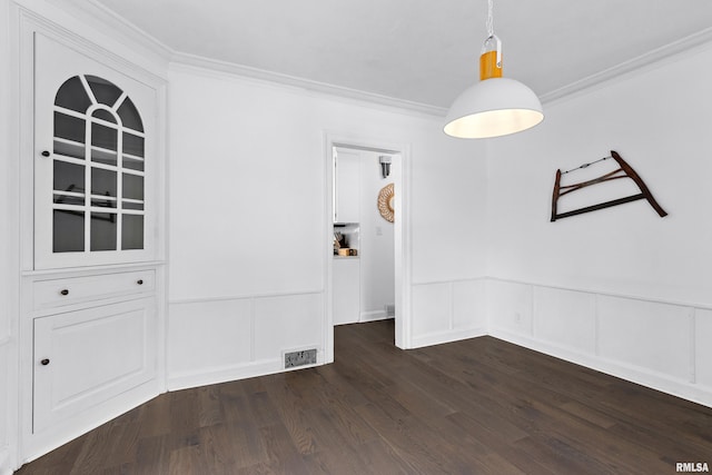136 E Oak Park Dr, Peoria, IL 61614 - unfurnished dining area with ornamental molding, dark wood-type flooring, wainscoting, and a decorative wall