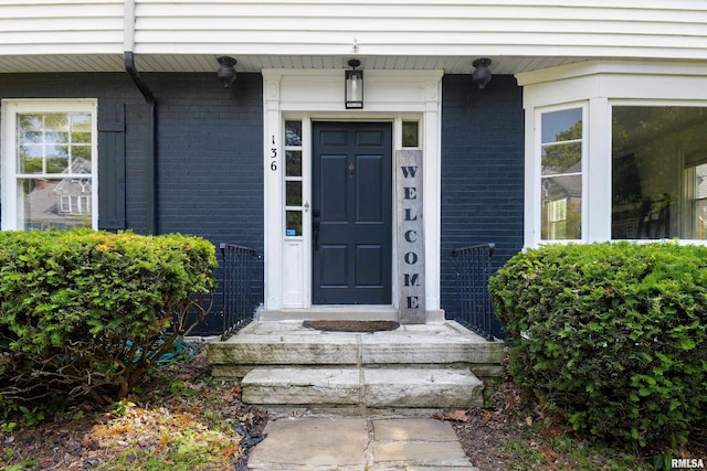 136 E Oak Park Dr, Peoria, IL 61614 - doorway to property featuring brick siding