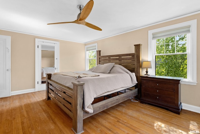 136 E Oak Park Dr, Peoria, IL 61614 - bedroom featuring light wood-style flooring, crown molding, and a ceiling fan
