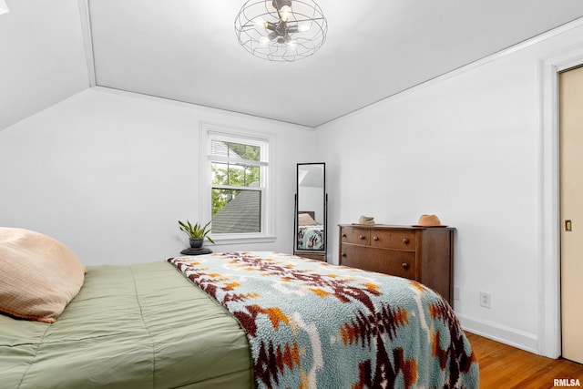 136 E Oak Park Dr, Peoria, IL 61614 - bedroom featuring wood finished floors and lofted ceiling