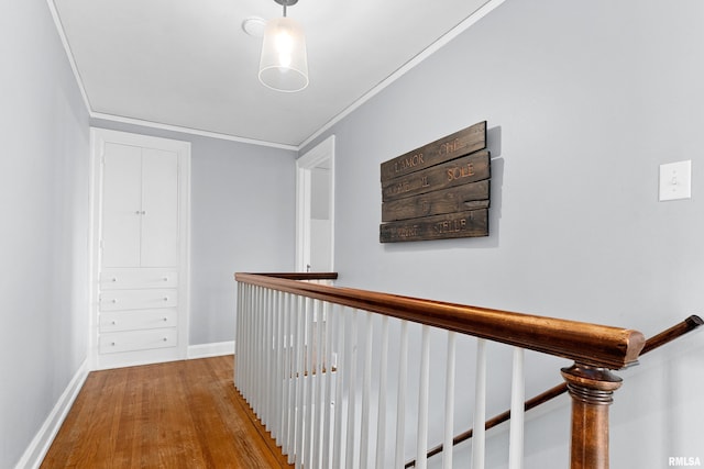 136 E Oak Park Dr, Peoria, IL 61614 - corridor featuring wood finished floors, ornamental molding, and an upstairs landing