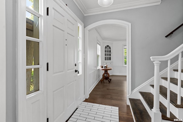 136 E Oak Park Dr, Peoria, IL 61614 - entrance foyer with ornamental molding, arched walkways, stairs, and wood finished floors