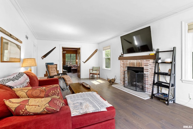 136 E Oak Park Dr, Peoria, IL 61614 - living area with crown molding, wood finished floors, and a fireplace